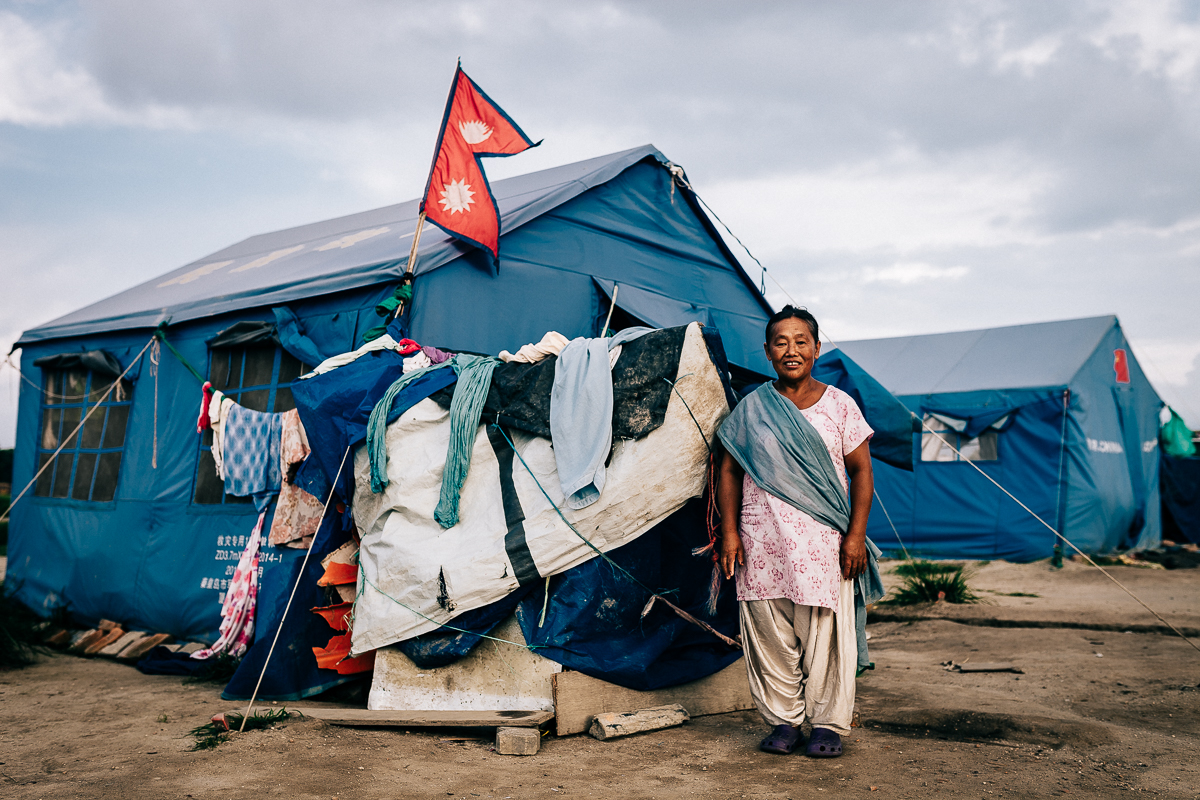 One of the many environmental refugee requested for a portrait of herself and the Nepal's national flag together. Kathmandu, Nepal | 2015
