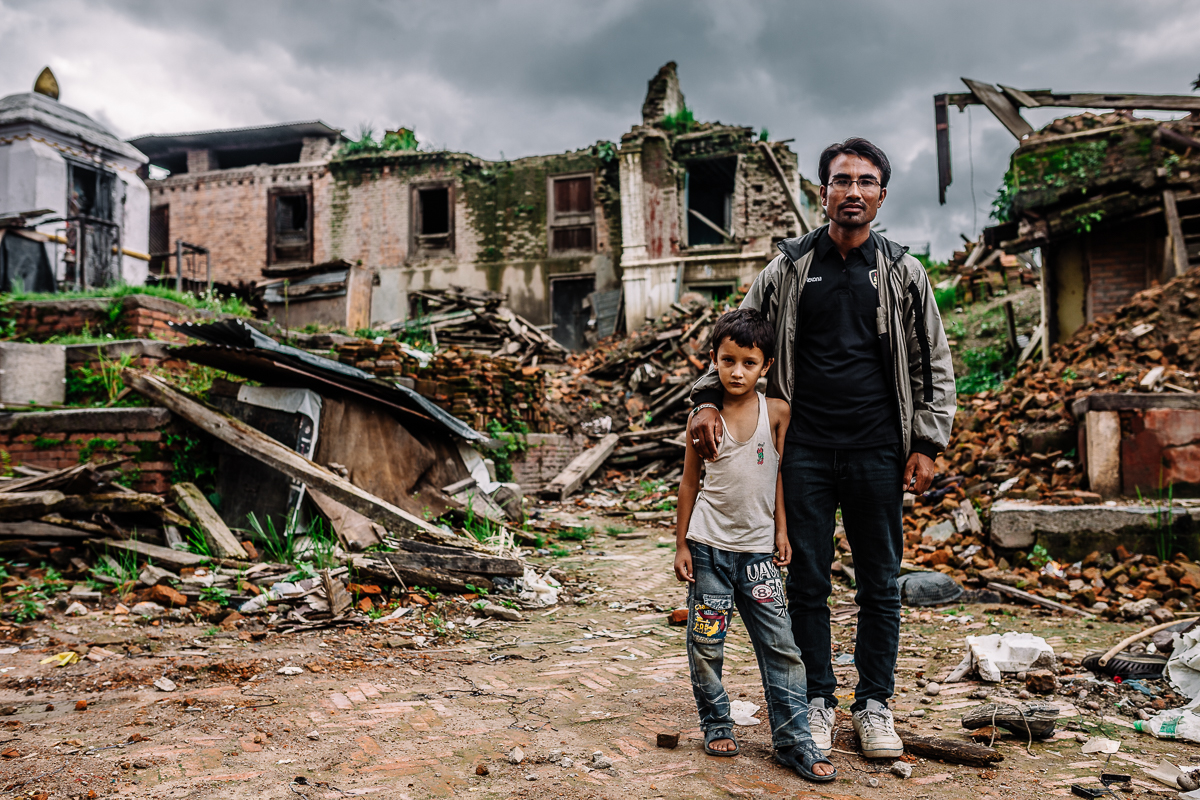 Shree Krishna had to dig for hours continuously to save his own son who was trapped under the rubbles. Reeling from his horrifying experience, he has decided to dedicate his time to social community work with the Red Cross as his way of being grateful for the second chance in life. Photograph was taken infront of their old home. Sankhu, Nepal | 2015