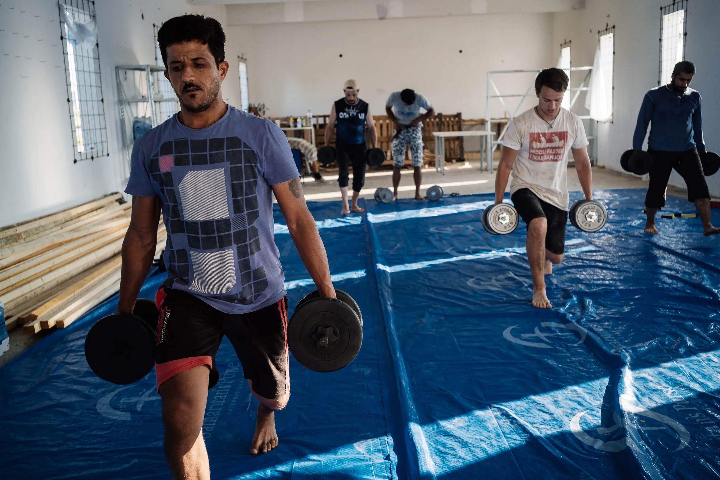 One glance and you might mistake them as future olympians. With the way they stayed focus during the session and the effort they put into their trainings, no one can be faulted if they make that mistake. "Let's do a couple of laps of lunges with weights back and forth, alright guys?" Matthew passed on the instructions to them. But one lap down and that was it. They crashed. They could have been professional athletes but they are way over their prime years now. All of them are above 30, except for one. Maybe they could have made it that far if they have had a different life. And the 'gym' that they train in? It looks like anything but a gym in reality. No machines, no air conditioning, no mirrors, only dumbbells without a rack. But none of that matters. The possibilities are already limitless with just these fixed weights. To them, they wish their life could also have a fraction of that possibilities too. But they don't. So they keep coming back to this derelict gym, thrice per week, as if to dream of all the possibilities that they could have, in another life.