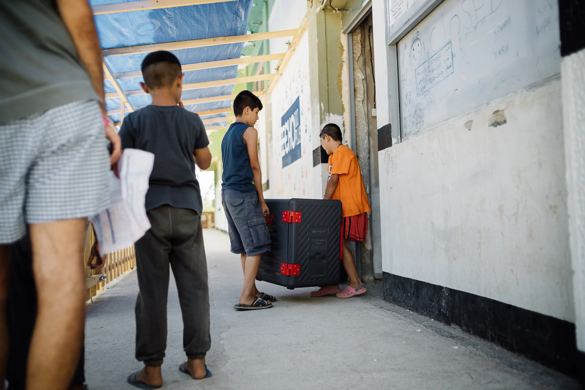 After breakfast, Ismail spends 2 hours of his time as a translator between the local residents and the volunteers at the food warehouse. This is also where he brushes up on his English.