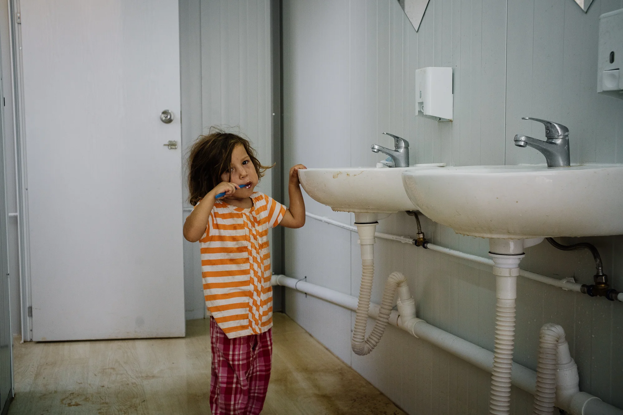 Kurdistan brushing her teeth looking stunned when we finally found her.