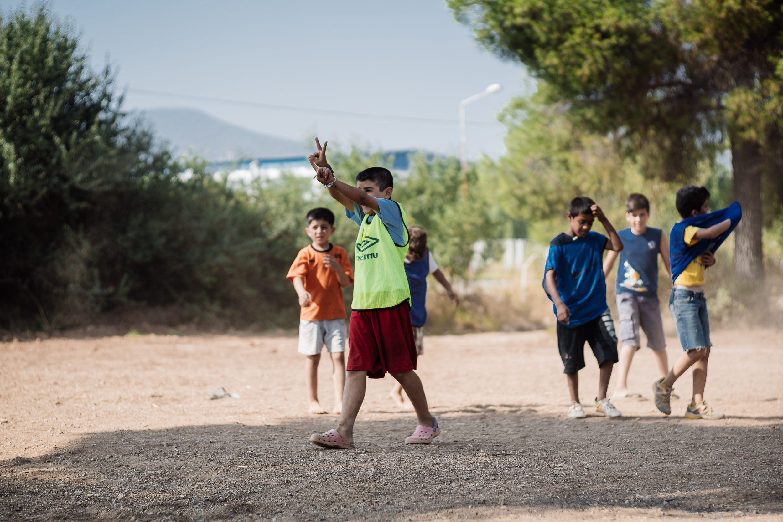  While waiting for his class to start, Ismail attends the football training in camp. 