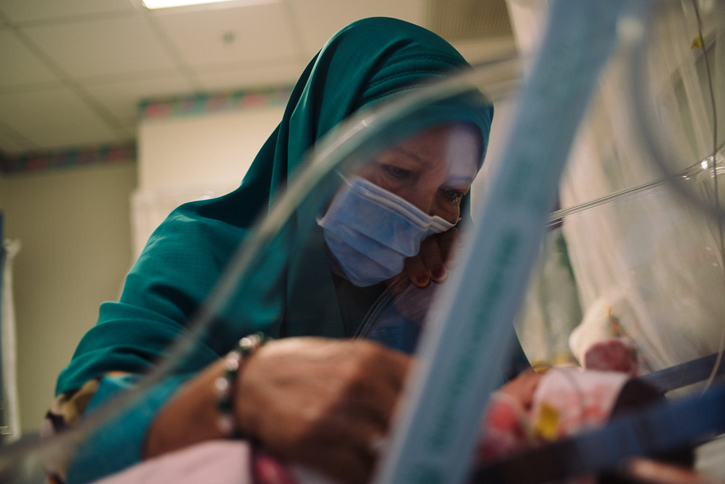 Hidayah's mother singing a tune of prayer for Hana on her visit.