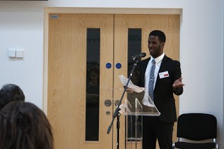 Ali Aden delivering his speech at the Character Symposium.