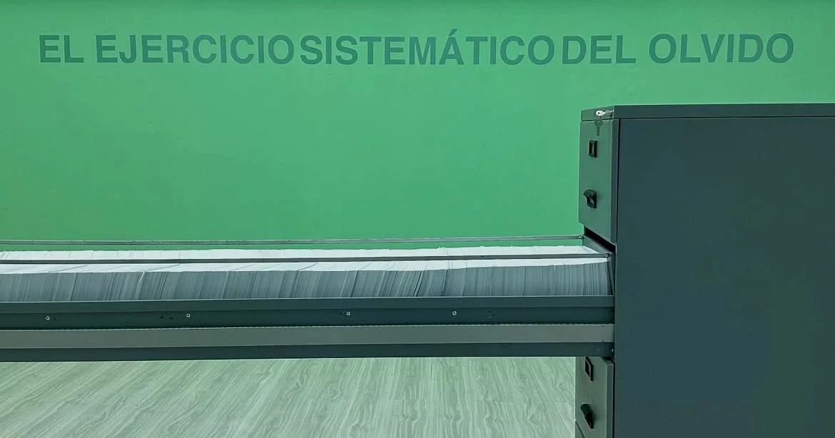 Mordiendo Polvo · Wall inscription and filing cabinet · UN_FAIR, Centro Tequendama · Bogotá, Colombia, 2025