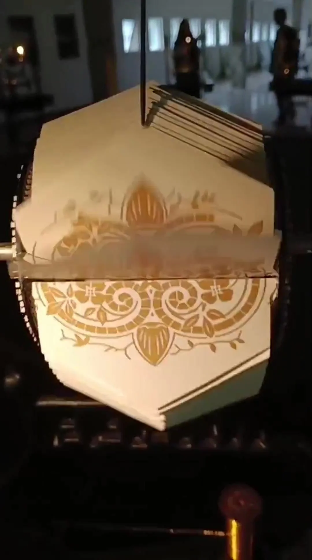 Hilo Vano · Animated floral ornament derived from the sewing-machine decoration. BIAM, Medellín, 2025. Video still from the original installation walkthrough, 03:44.