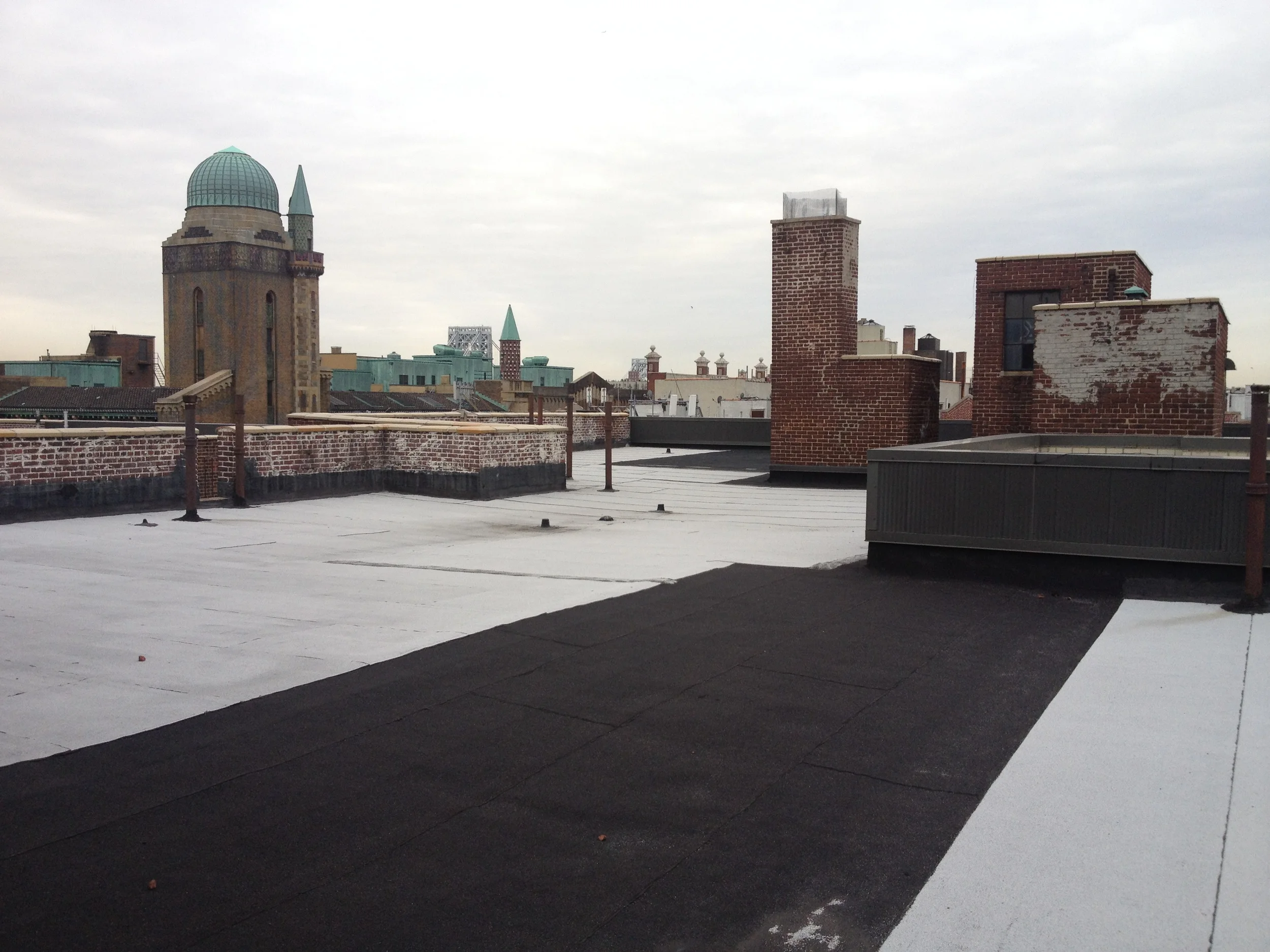  Pictured above is an example of roofing work at 142 Laurel Hill Terrace - part of a restoration project by Bulado General Contractors. 
