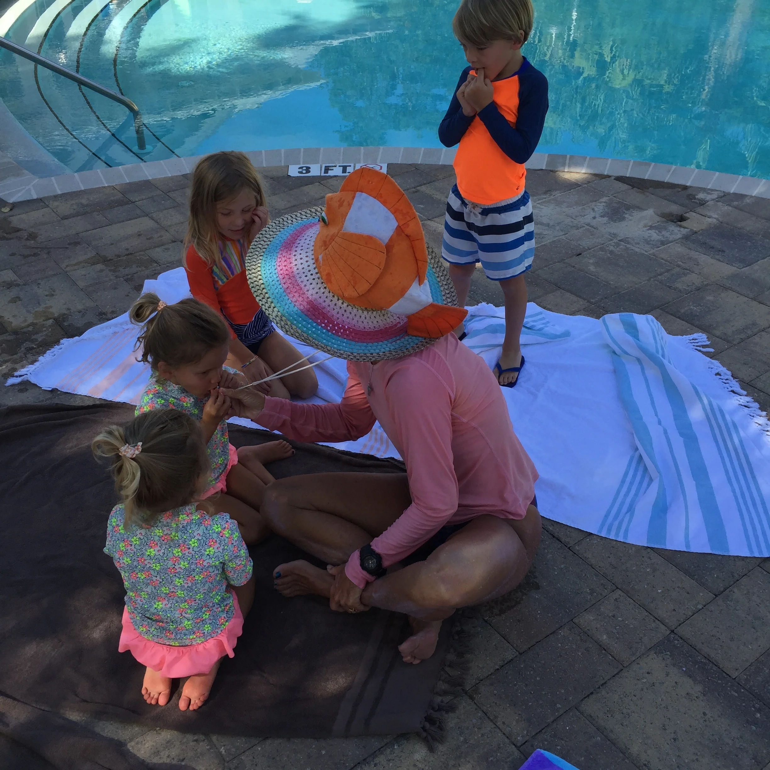 Going over pool rules before entering the water. This is a ritual that the kids love.