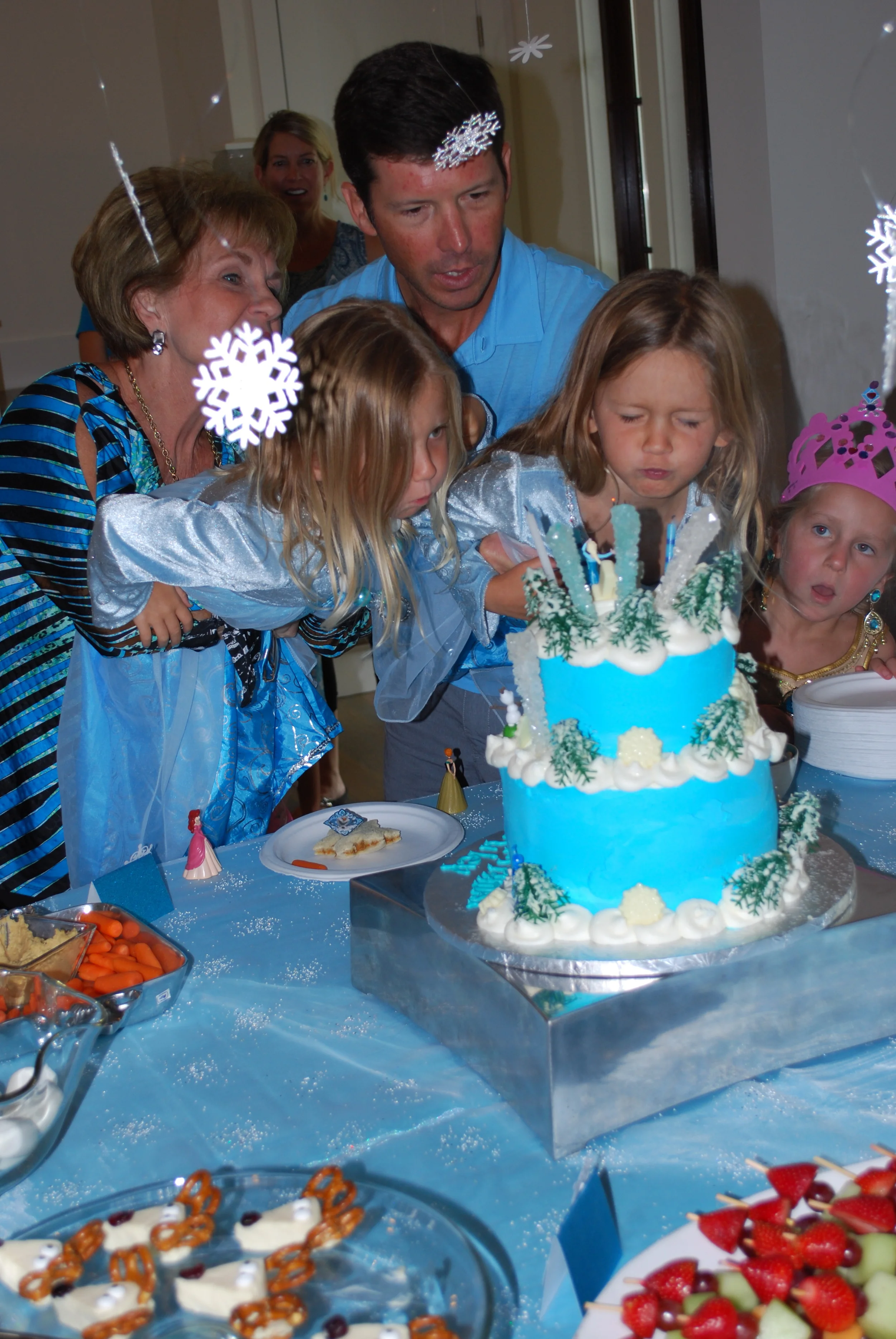 Blowing out the candles. Look at Cooper's face!! She's wishing hard --- LOVE!