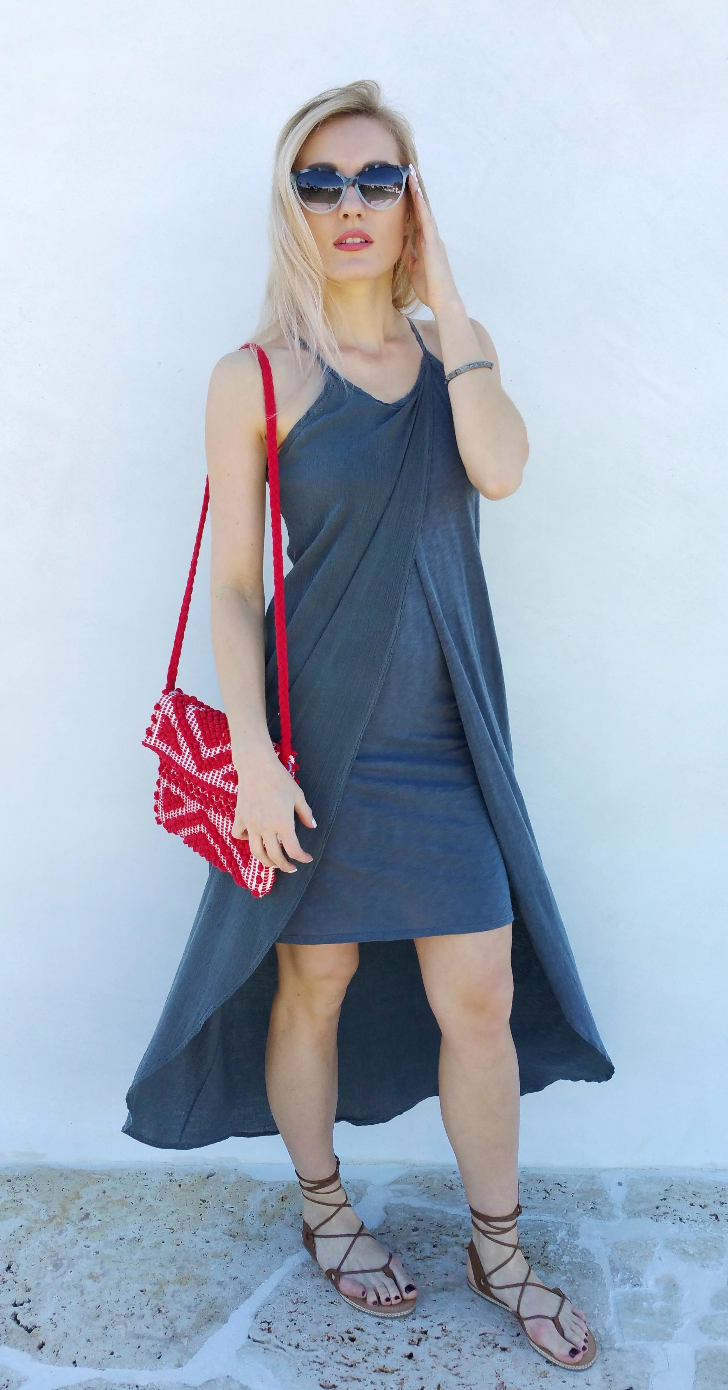 Marta is wearing gray high-low dress by Stateside, red hand bag by Antonello, sandals by LeSwim, Krewe du Optic sunnies & studded bracelet by S Carter.
