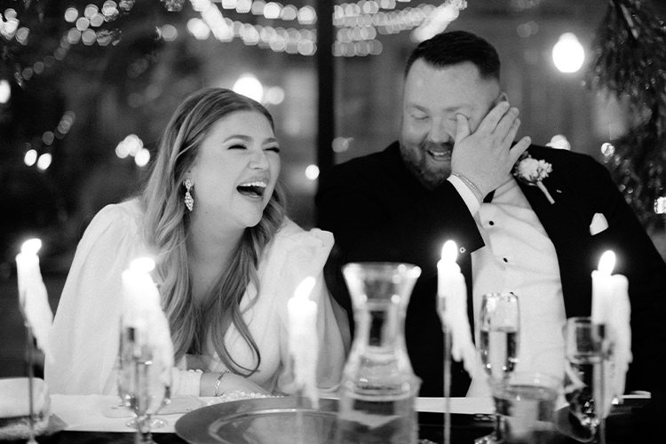 bride-groom-laughing-crying-during-wedding-speaches.jpg