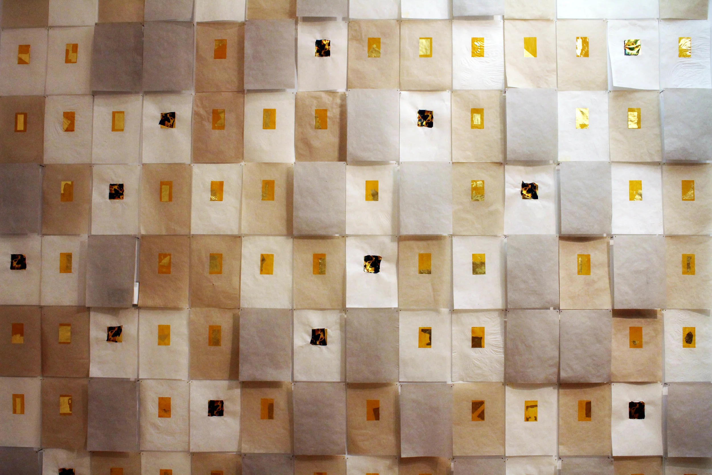   Weight, 2015     10in x 14in (individual sheets) 14ft x 14ft (installed) Handmade abaca paper, 24k gold leaf, ash, photo emulsion lift     'Weight'&nbsp;  is a series of handmade paper representing the worth of objects lost in the fire as identifie