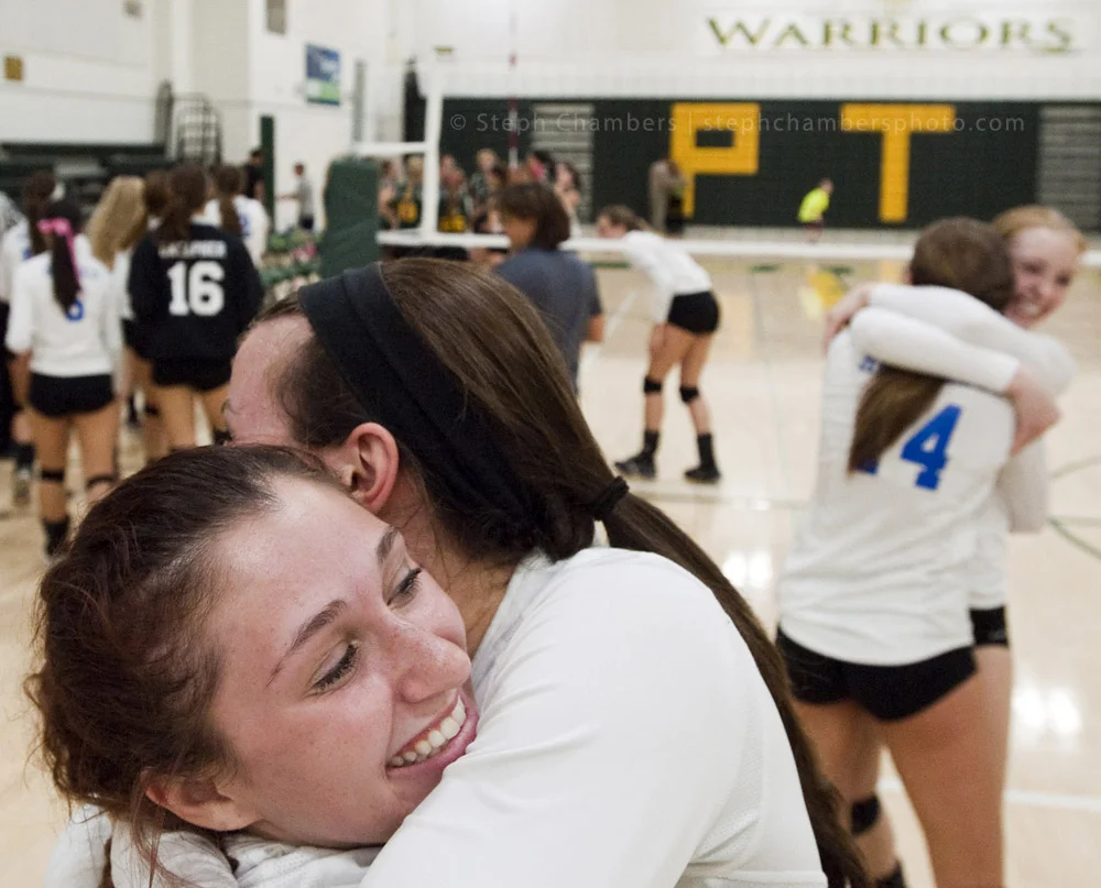 Hempfield's Emma Pevarnik receives a hug from Gabby Holmberg after beating Penn-Trafford during a volleyball game on Tuesday, Oct. 20, 2015 at Penn-Trafford High School. Hempfield won.