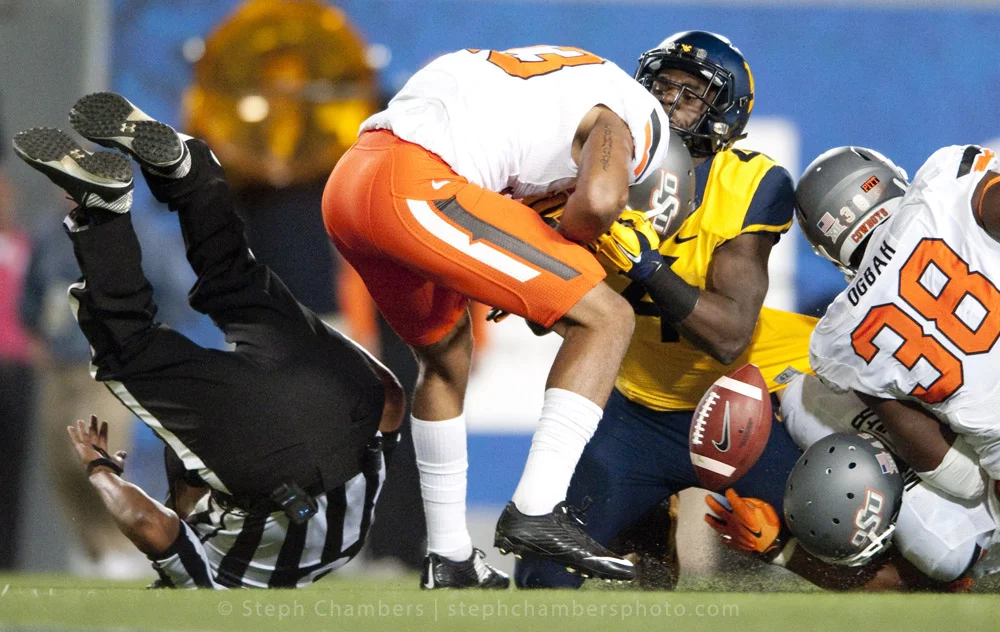 West Virginia running back Wendell Smallwood (4) fumbles the ball near the end zone against Oklahoma State  on Saturday, Oct. 10, 2015 at Milan Puskar Stadium in Morgantown, W.Va. Oklahoma State won 33-26 in overtime.