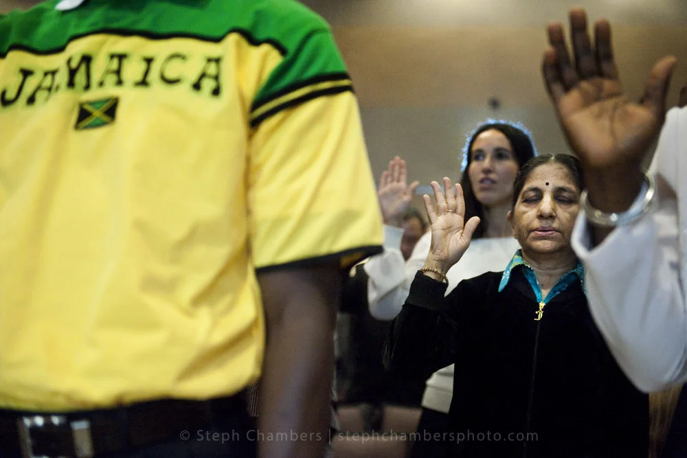 Kokilaben Patel of India closes her eyes and holds up her right hand as she takes an oath of allegiance during a naturalization ceremony on Friday, Oct. 23, 2015 at Indiana University of Pennsylvania's Kovalchick Convention Center-Toretti Auditorium…