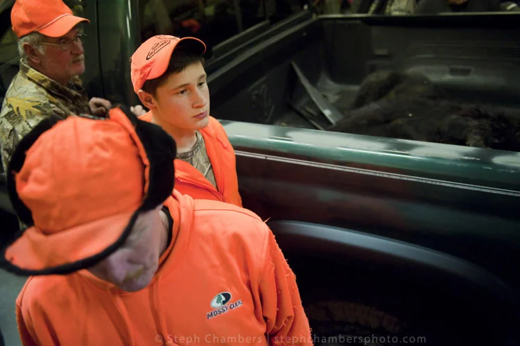 Gordon Matson, 17 of Ligonier waits with other hunters while his bear is weighed at the Pennsylvania Game Commission Southwest Region Office on Saturday, Nov. 21, 2015, in Bolivar.