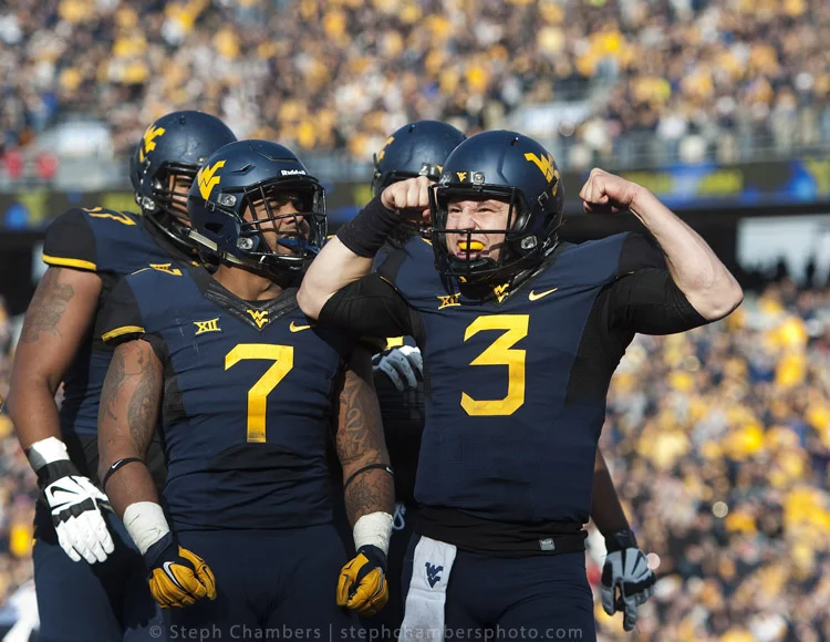 West Virginia quarterback Skyler Howard (3) reacts after his touchdown against Texas Tech on Saturday, Nov. 7, 2015, at Milan Puskar Stadium in Morgantown, W.Va. WVU won 31-26.
