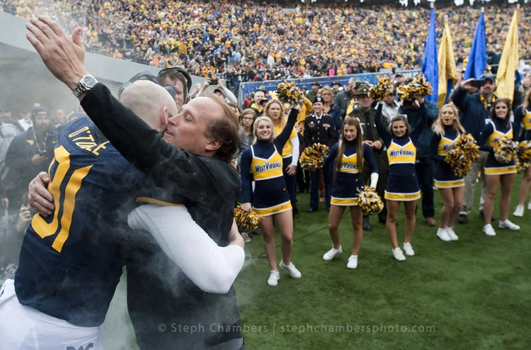West Virginia head coach Dana Holgerson greets West Virginia punter Nick O'Toole (91) during senior day festivities before playing Iowa State on Saturday, Nov. 28, 2015, at Milan Puskar Stadium in Morgantown, W.Va. WVU won 30-6.