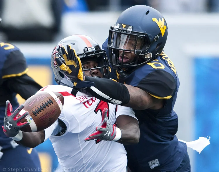 West Virginia safety Dravon Askew-Henry (6) defends Texas Tech wide receiver Jakeem Grant (11) on Saturday, Nov. 7, 2015, at Milan Puskar Stadium in Morgantown, W.Va. The pass was incomplete. WVU won 31-26.