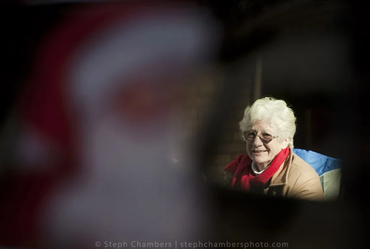 A woman is seen through a window of a Santa-themed float during the 24th annual holiday parade on Saturday, Nov. 21, 2015, in Greensburg.
