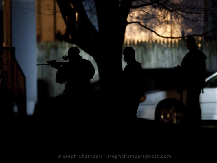 Police search for a suspect in connection with an officer shooting on Saturday, Nov. 28, 2015 in Seward.