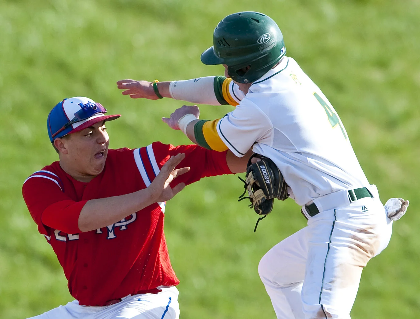 Mt. Pleasant's Jason Beranek tags out Penn-Trafford's Robbie Buck on Friday, April 1, 2016 at Penn-Trafford High School. Penn-Trafford won 3-2.