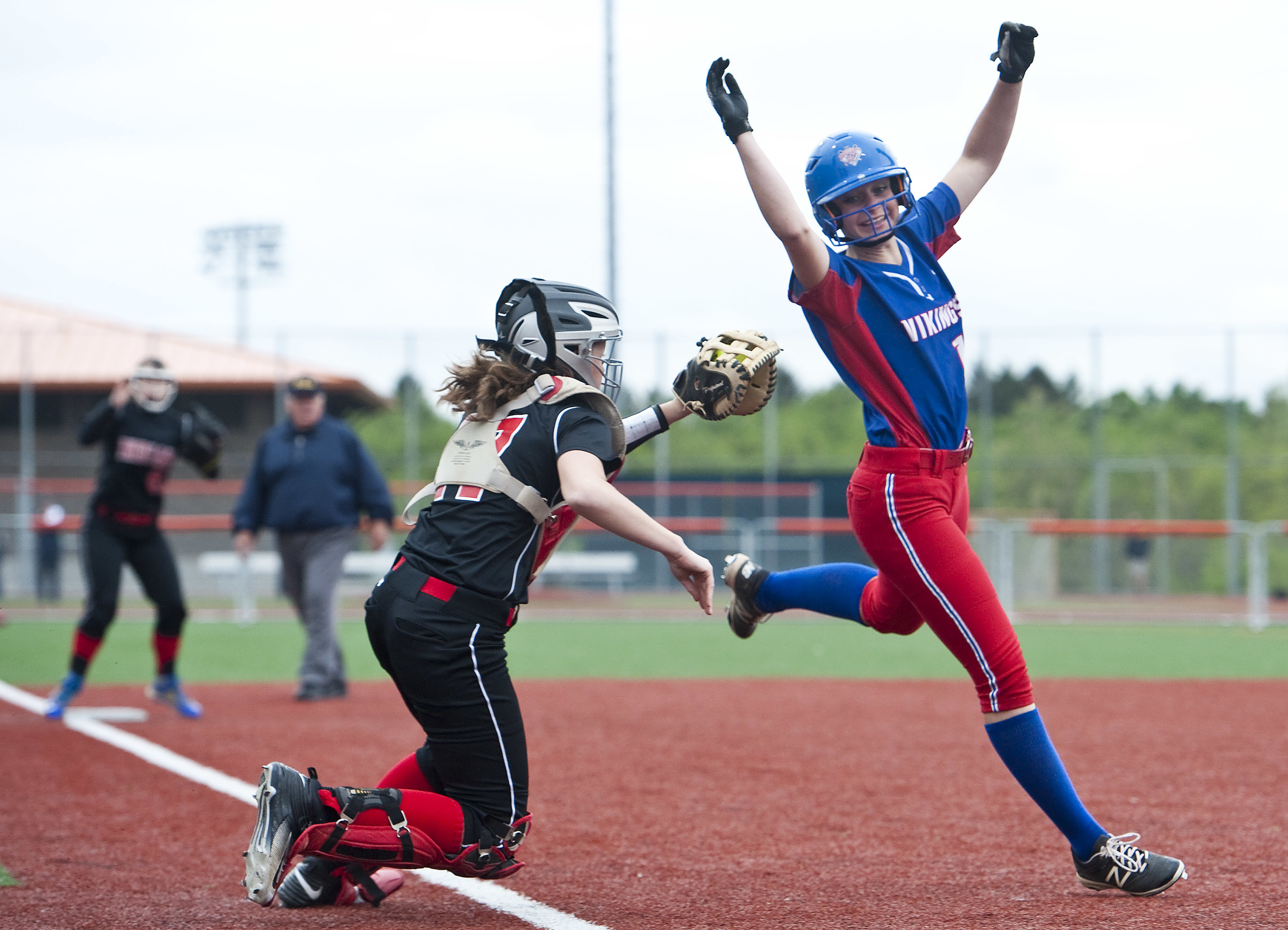 Mt. Pleasant's Christiana Czegan attempts to avoid the tag by Indiana's Logan Everett on Wednesday, May 18, 2016 at Greater Latrobe High School. Mt. Pleasant won 3-2 in eight innings.