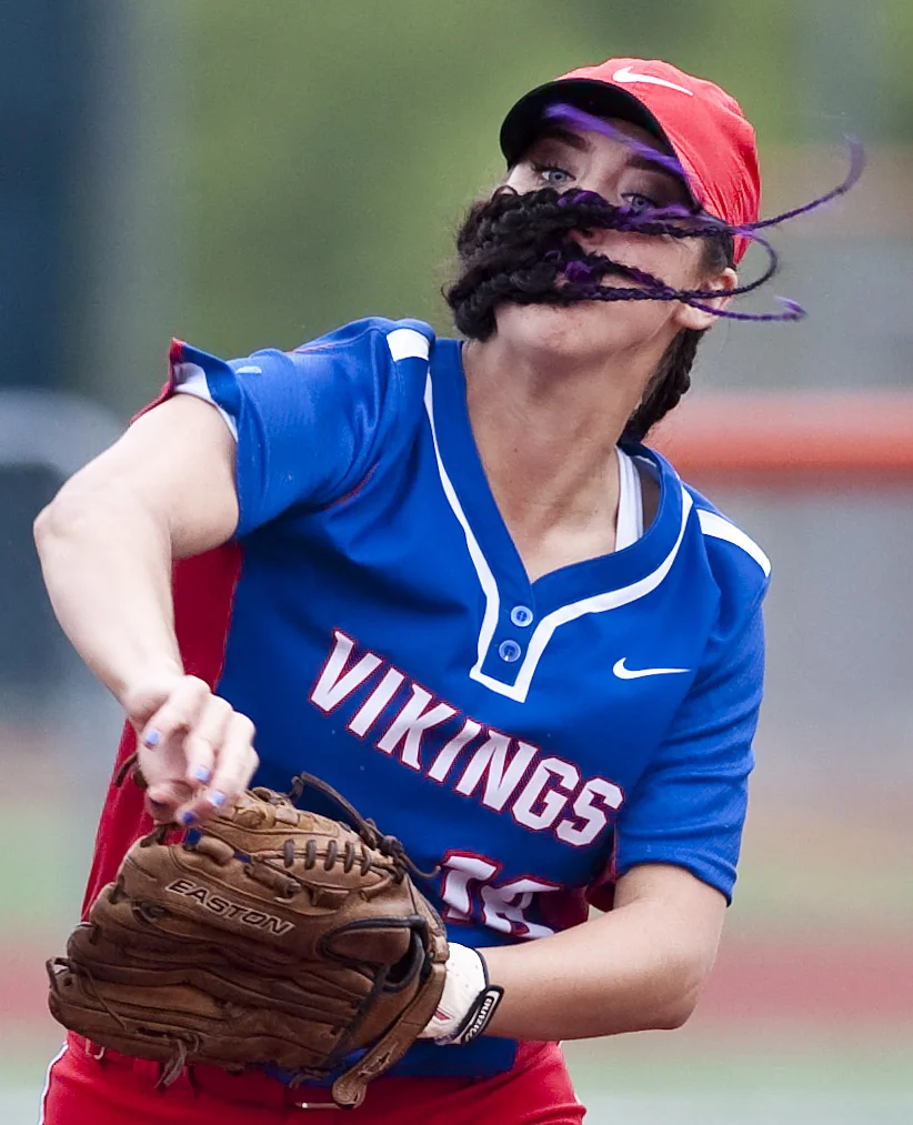 The braids of Mt. Pleasant's Maddie Kromer fly as she throws to first base against Indiana on Wednesday, May 18, 2016 at Greater Latrobe High School. Mt. Pleasant won 3-2 in eight innings.