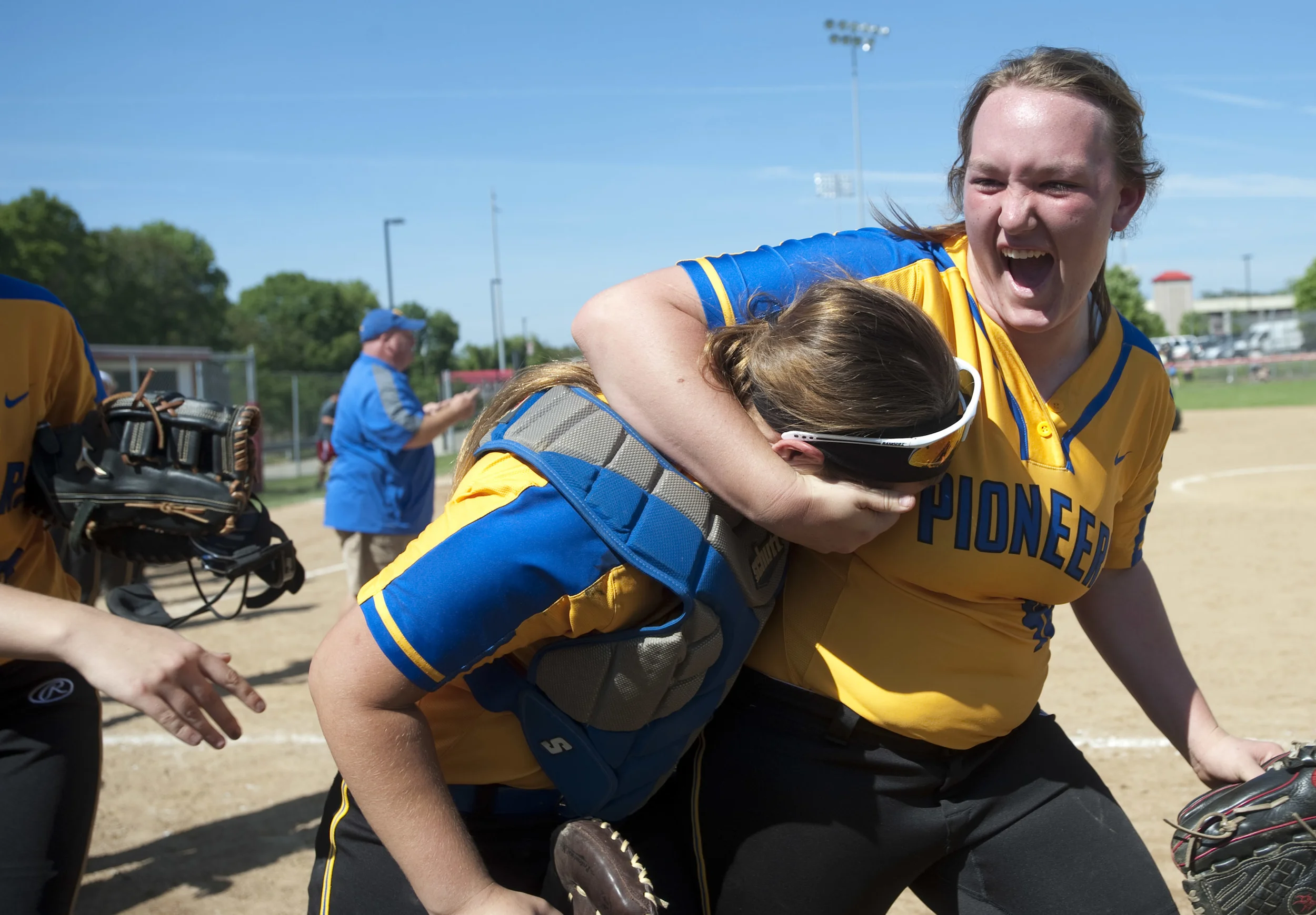 West Greene's Madison Renner puts catcher Shelby Morris in a headlock after beating Monessen during the WPIAL Class A softball semifinal on Wednesday, May 25, 2016 at California University of Pennsylvania. West Greene won 10-0.