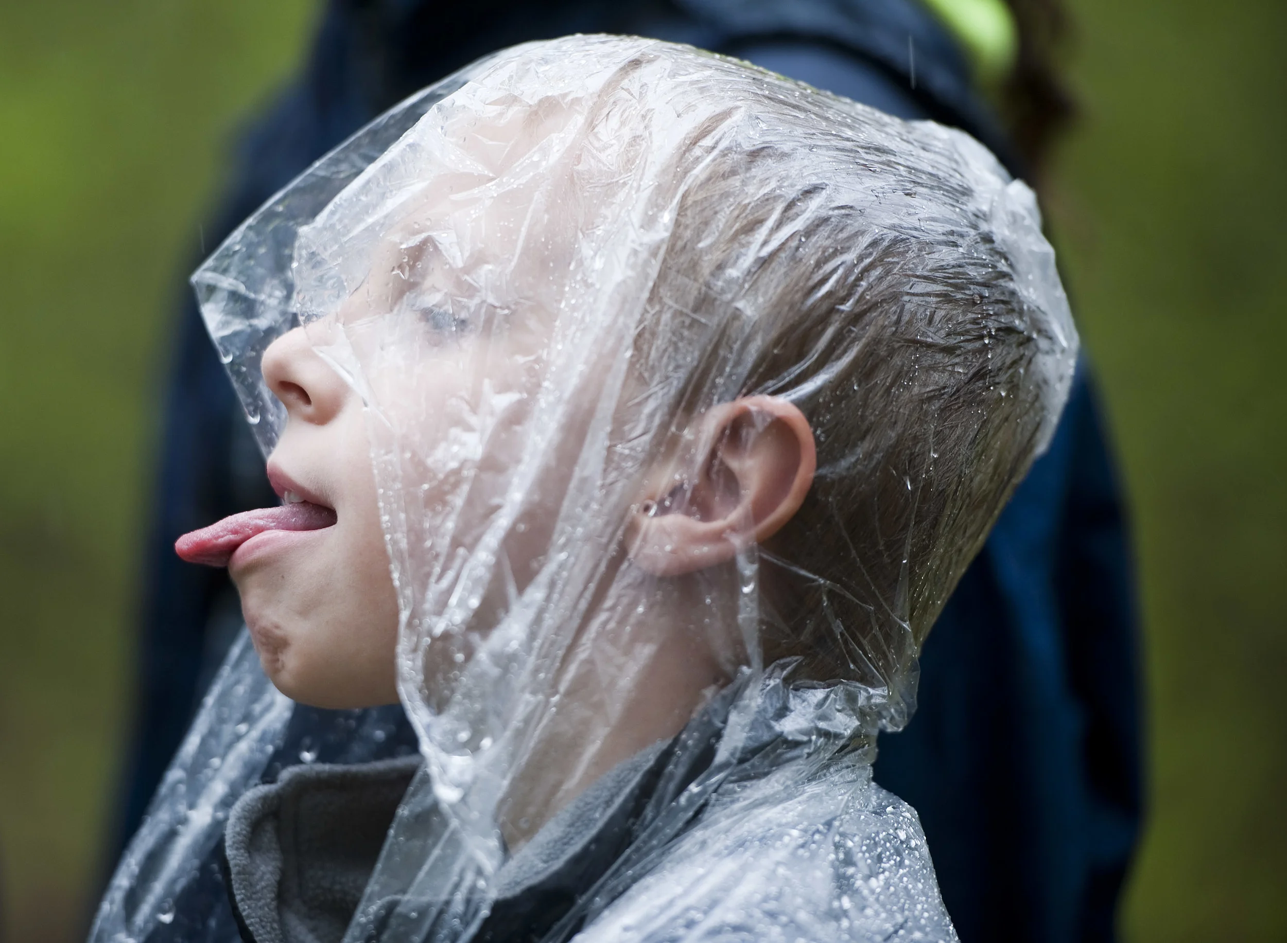 Kaden Theys, 8, of South Fork, Cambria County, catches rain with his tongue while hiking with event organizer and Bigfoot expert Eric Altman of Jeannette as Altman leads a group along a trail during the 2016 Pennsylvania Bigfoot Camping Adventure at Benner's Meadow Run campground near Farmington on Friday, May 6. The Farmington area has been known as a Bigfoot hotbed with numerous encounters reported by campers, hunters and locals.