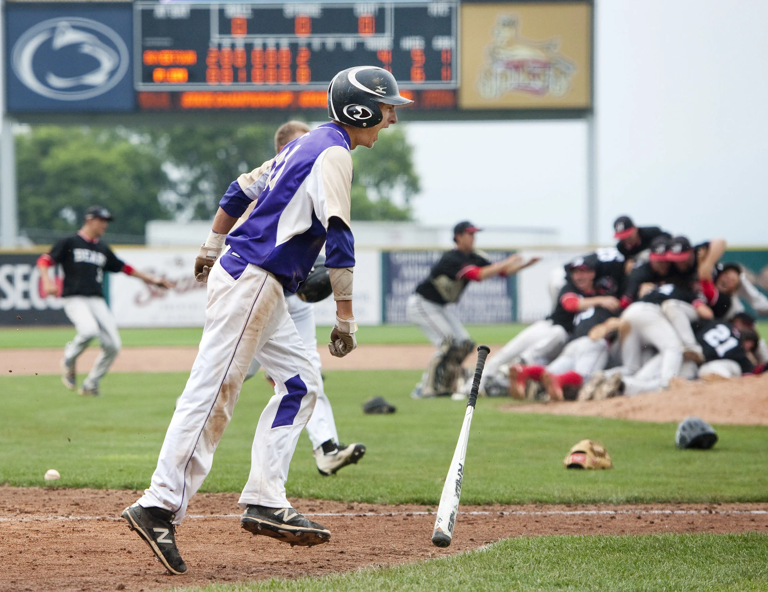 Plum’s Jason Maltese throws his bat after he struck out against Boyerstown in the last out during the Class AAAA PIAA Baseball Championships Thursday, June 16, 2016 at Penn State University. Boyerstown won 4-1.