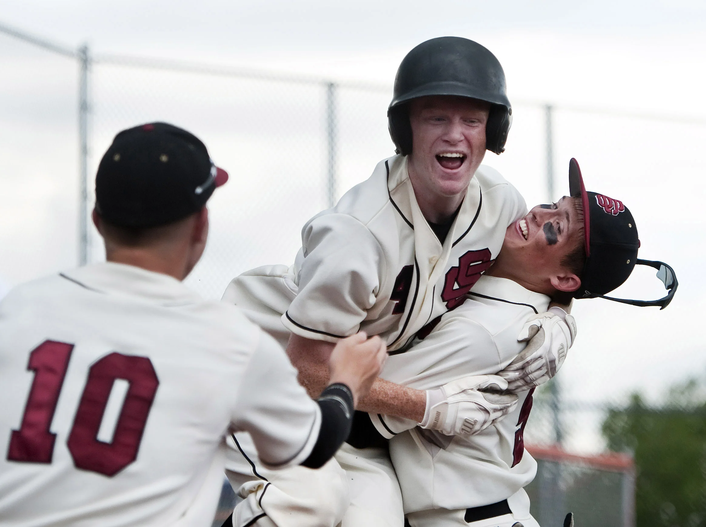 Serra Catholic’s Zachary Bowen is lifted by Serra Catholic’s Ryan Anselmino as Serra Catholic’s Jake Eged and teammates celebrate their win over Portage during a PIAA Class A playoff game on Monday, June 6, 2016 at Greater Latrobe High School. Serra Catholic won 4-3.