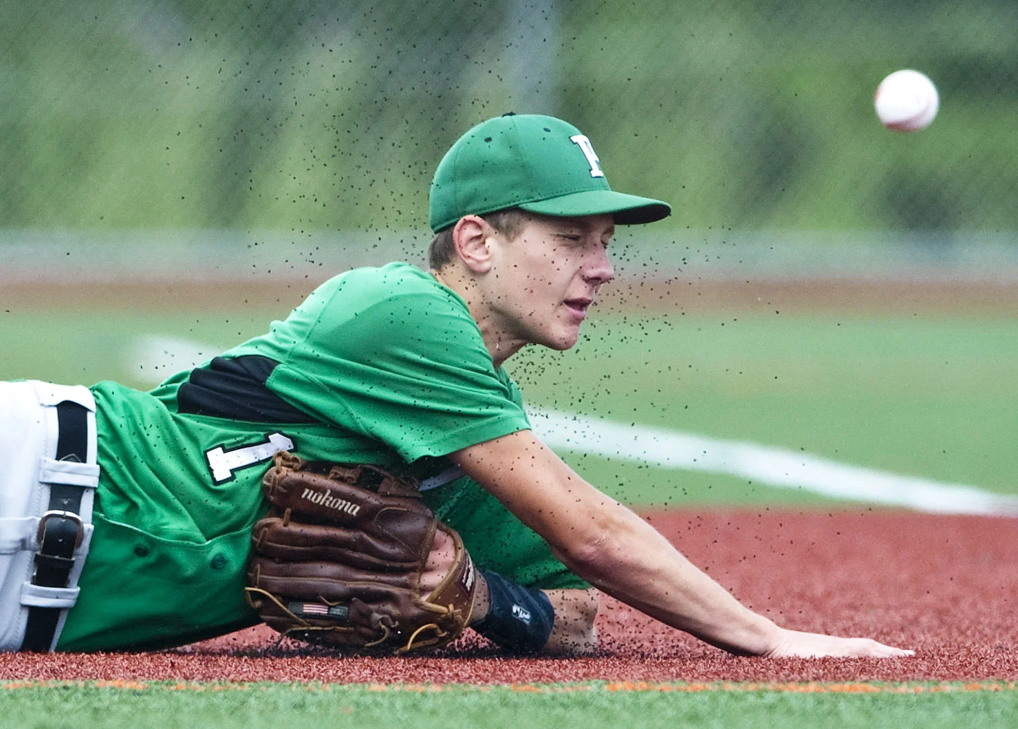 Portage's Nathan Teno dives but misses the ball against Serra Catholic during a PIAA Class A playoff game on Monday, June 6, 2016 at Greater Latrobe High School. Serra Catholic won 4-3.
