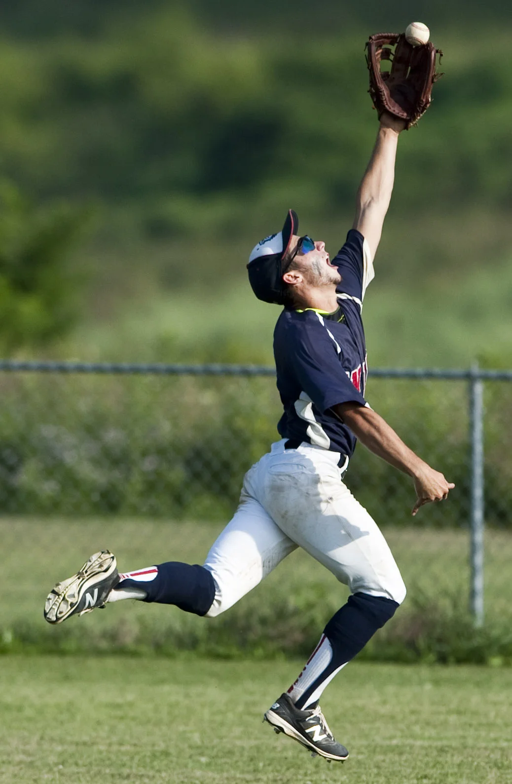 Unity's Vince Guerrieri leaps for the ball during a District 31 American Legion baseball playoff game against Murrysville on Thursday, July 7, 2016. Murrysville won 9-3.