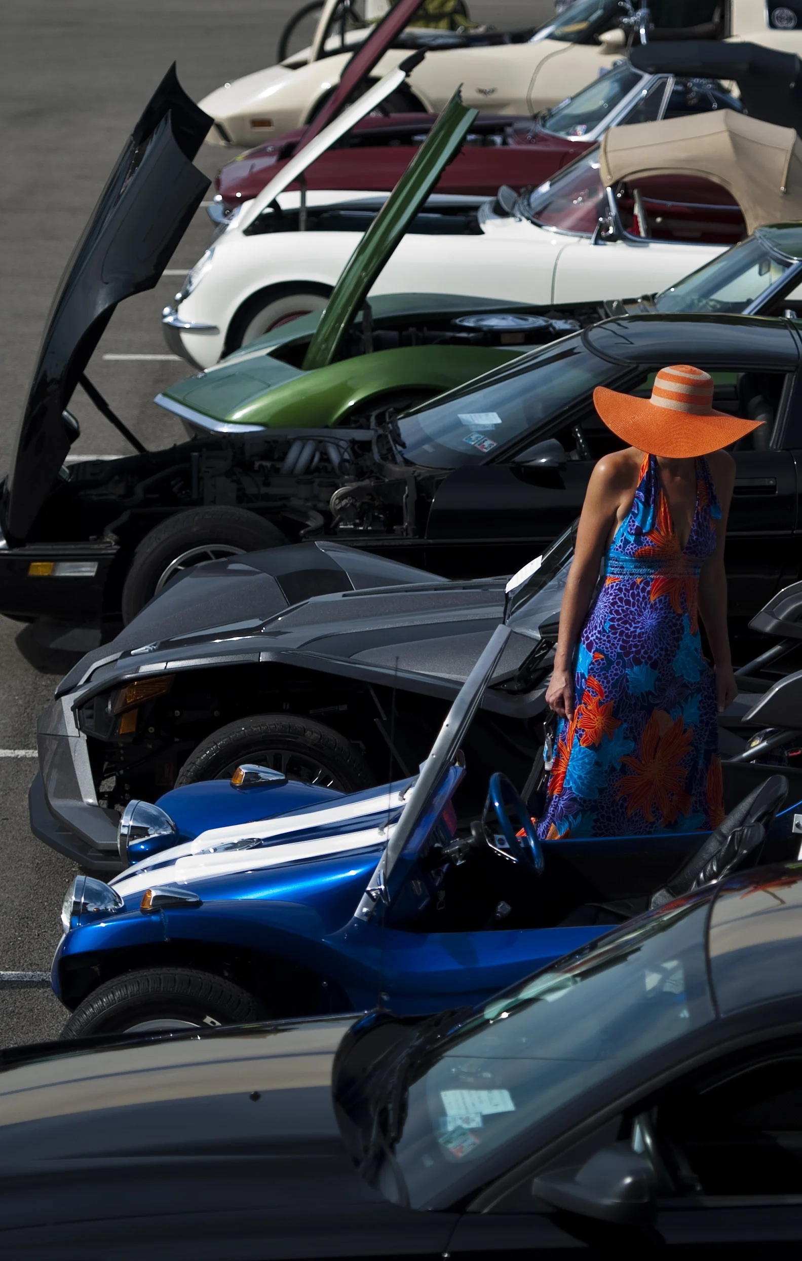 A woman, who did not wish to give her name, admires the car cruise during the Great American Banana Split Festival on Saturday, Aug. 27, 2016 in Latrobe.