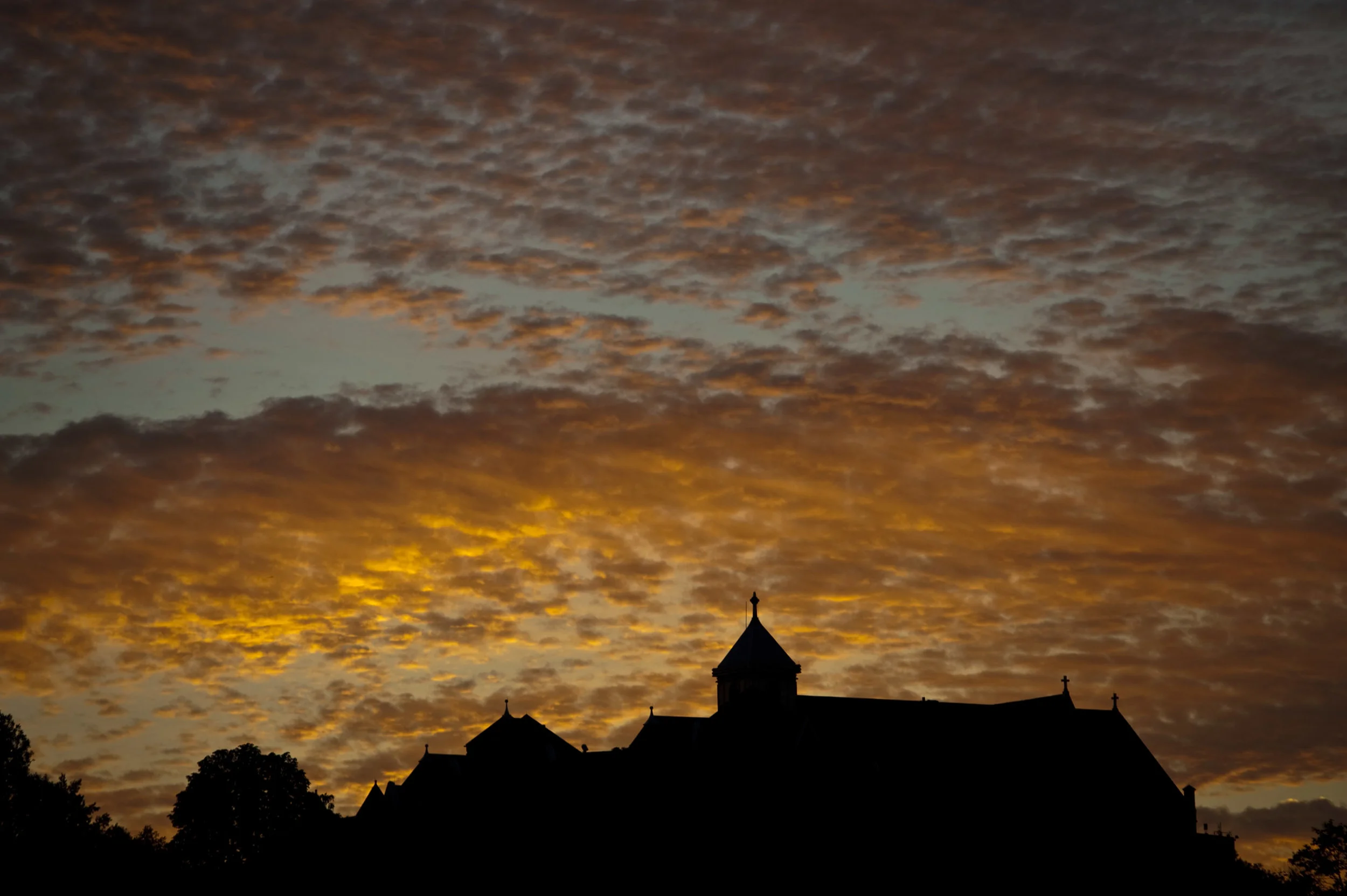 The sun sets behind Seton Hill University in Greensburg on Saturday, Sept. 3, 2016.