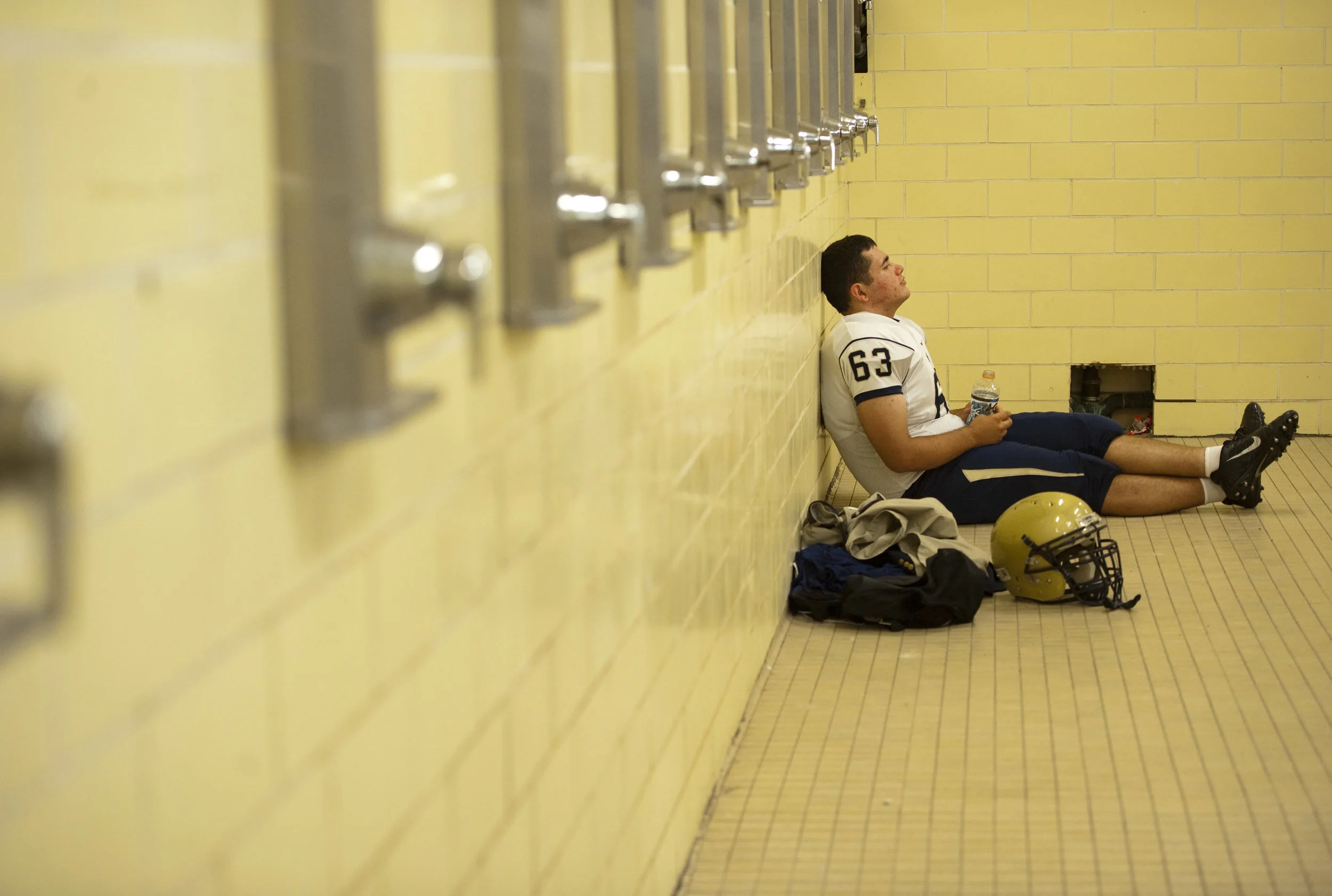 Franklin Regional’s Joe Cattani pauses for a moment in the shower before playing McKeesport on Friday, Sept. 2, 2016 in McKeesport. McKeesport won 14-7.