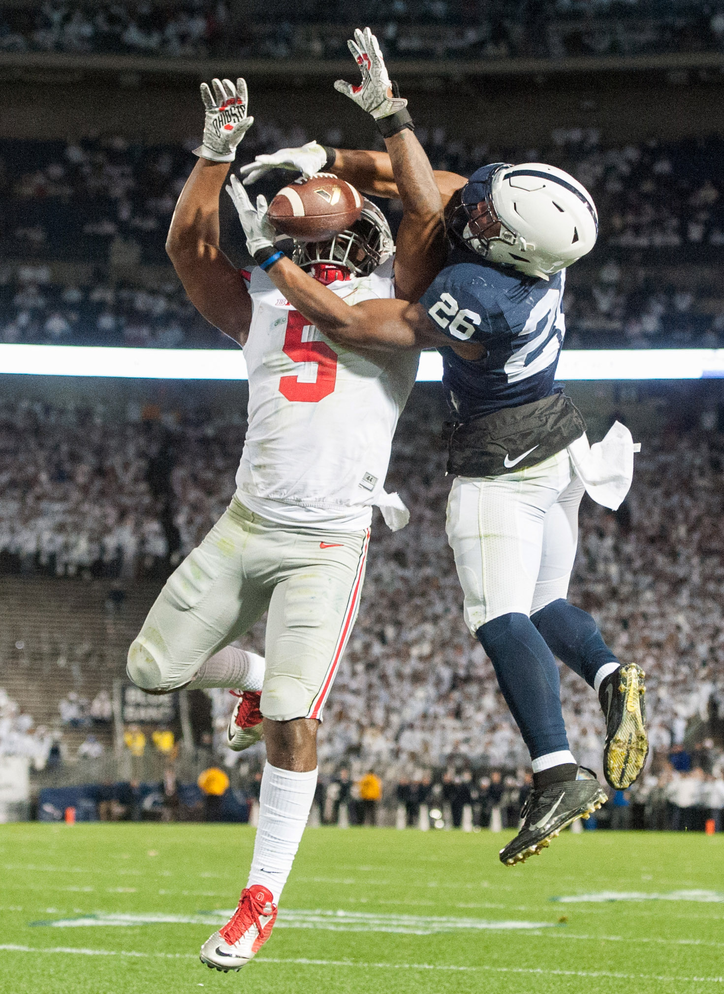  Penn State running back Saquon Barkley can't pull in a touchdown pass while pressured by Ohio State linebacker Raekwon McMillan during a college football game Saturday, Oct. 22, 2016, at Beaver Stadium in University Park. &nbsp;Penn State beat Ohio 