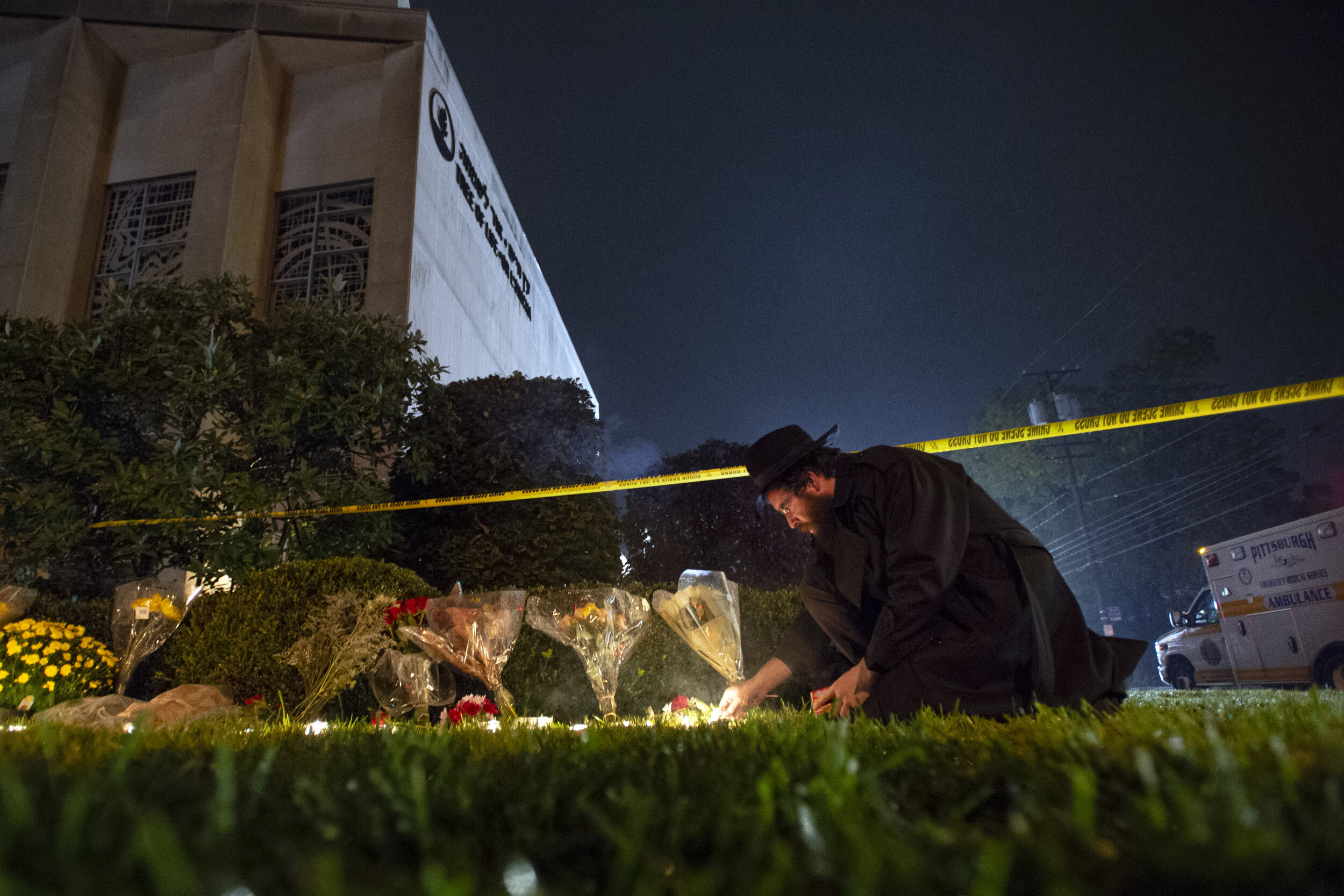  Rabbi Eli Wilansky of Squirrel Hill and the Chabad school lights a candle after the mass shooting at Tree of Life synagogue Saturday, Oct. 27, 2018, in Pittsburgh's Squirrel Hill neighborhood. Eleven people were killed and six were wounded, includin