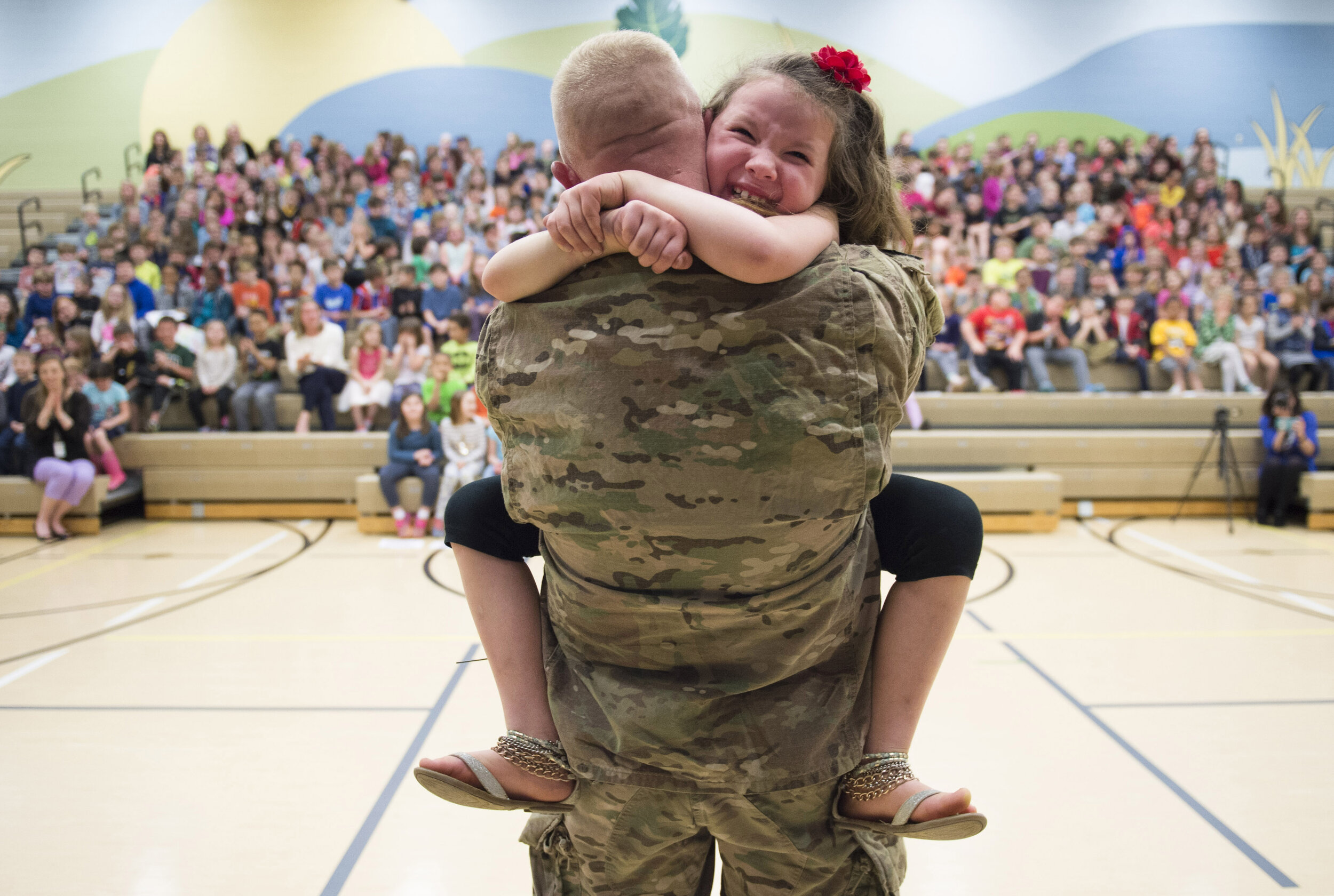  Second grader Imogen Nowak cries in the arms of her father United States Army Captain Erik Nowak after he surprised her during an assembly for National Kindness Week at Quaker Valley’s Osborne Elementary School in Sewickley on Tuesday, March 28, 201