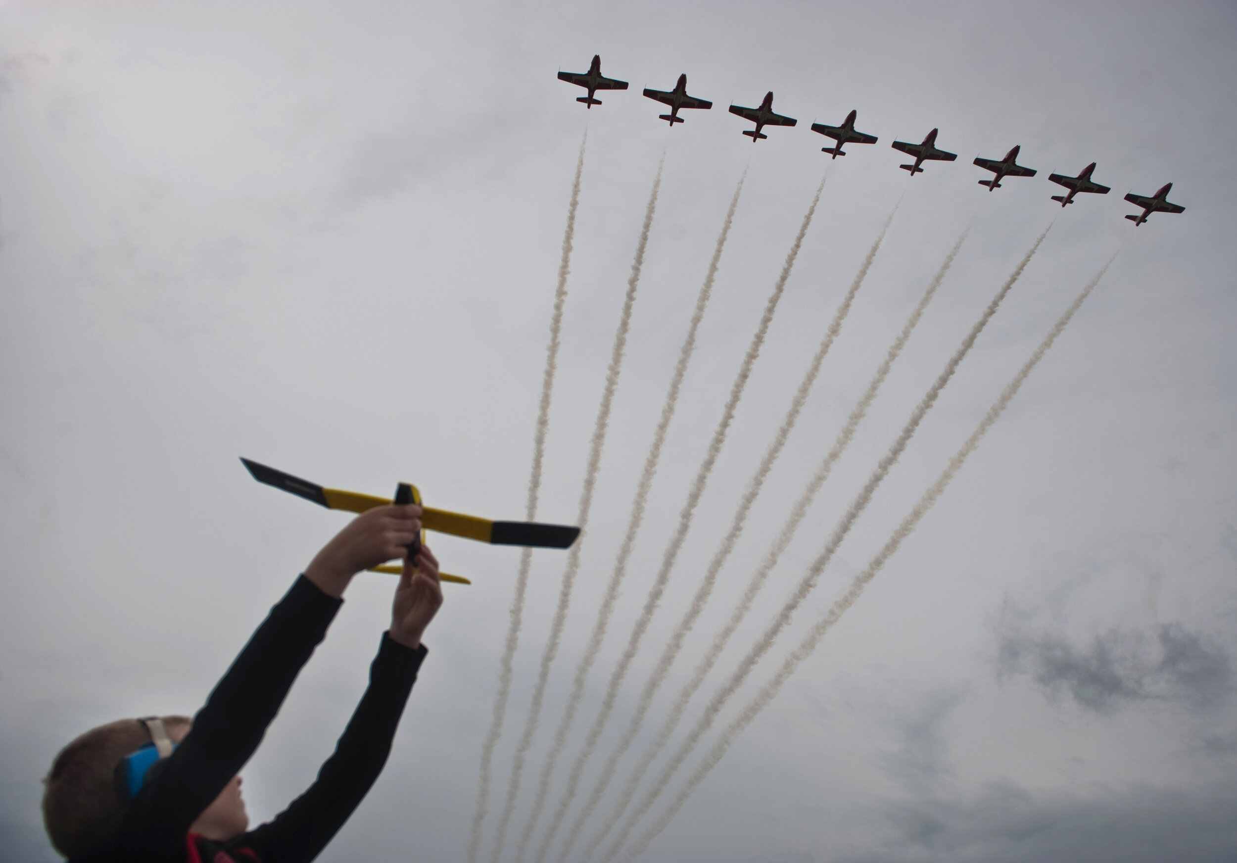  Lawson Miller, 6, of Canonsburg flies his toy airplane as the Canadian Forces Snowbirds pass overhead during the second day of the Shop ’n Save Westmoreland County International Air Show at Arnold Palmer Regional Airport in Unity Township on Sunday,