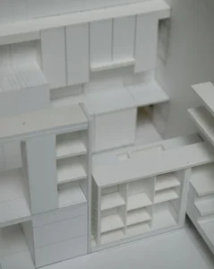 The architect's model. The kitchen design is a series of ' L's.