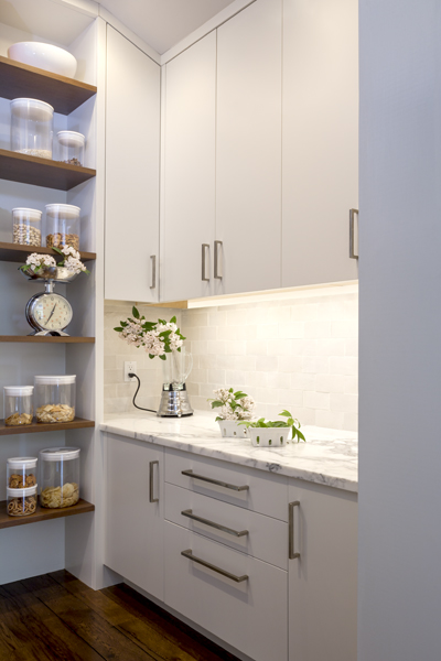 The walk-in pantry is user friendly. It allowed the wall space in the kitchen to be used for lots of windows.