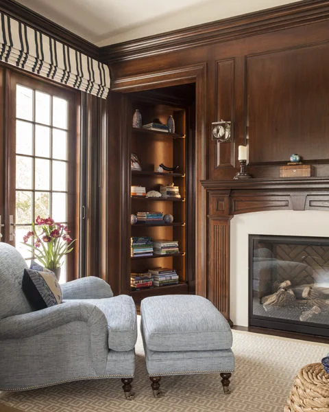 The sitting room just outside the office, with the alcove's bookcase beyond. Sliding pocket doors made by KR+H can be used to add privacy to either room.