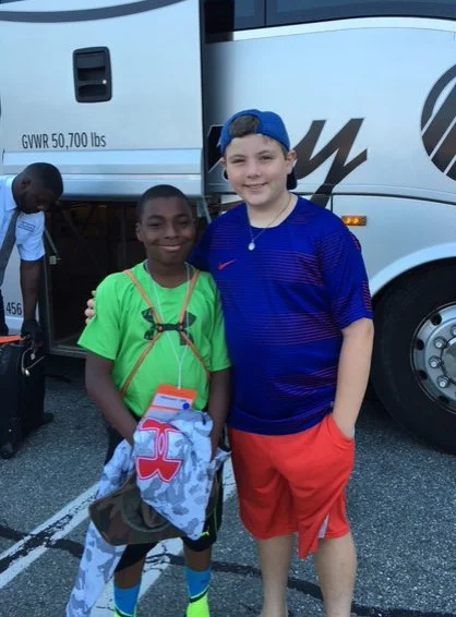 Zaire and Alex before Zaire boards the bus home...carrying lots of good memories.