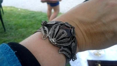 Morgana Mirage models her new bracelet with obsidian stone from Armenia, at the at the Armenian Food And Music Festival at the American Legion Farm in Haverhill, Mass. on Aug. 24.