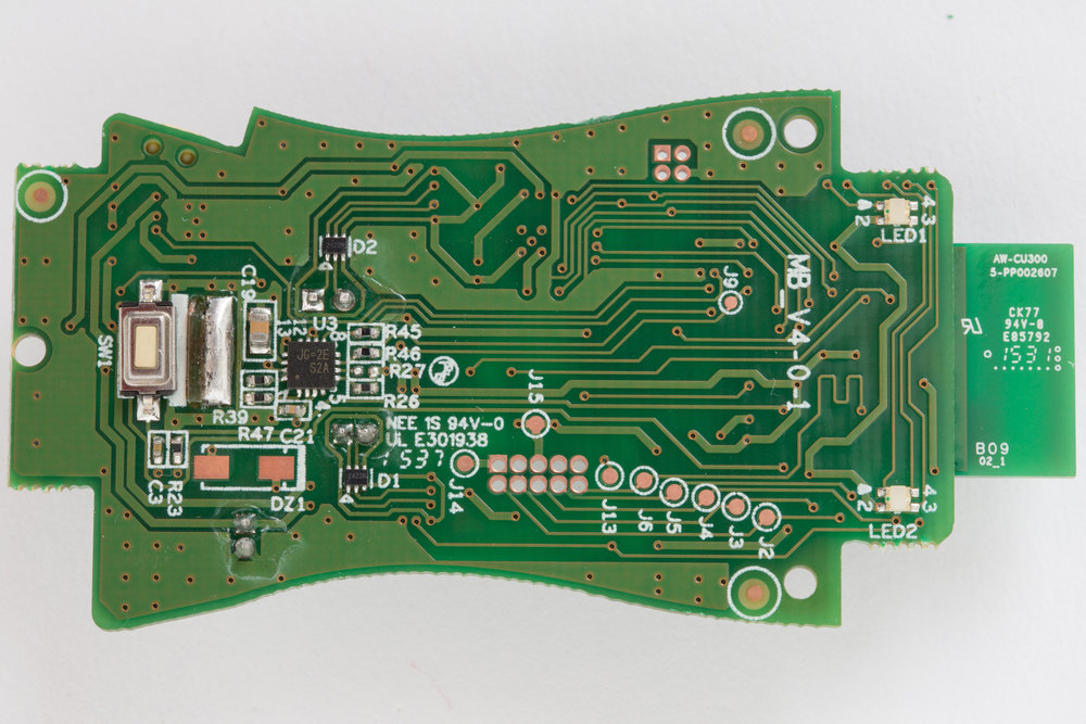 Hello Barbie main circuit board. Back side. Showing LEDs, test points, and main button.