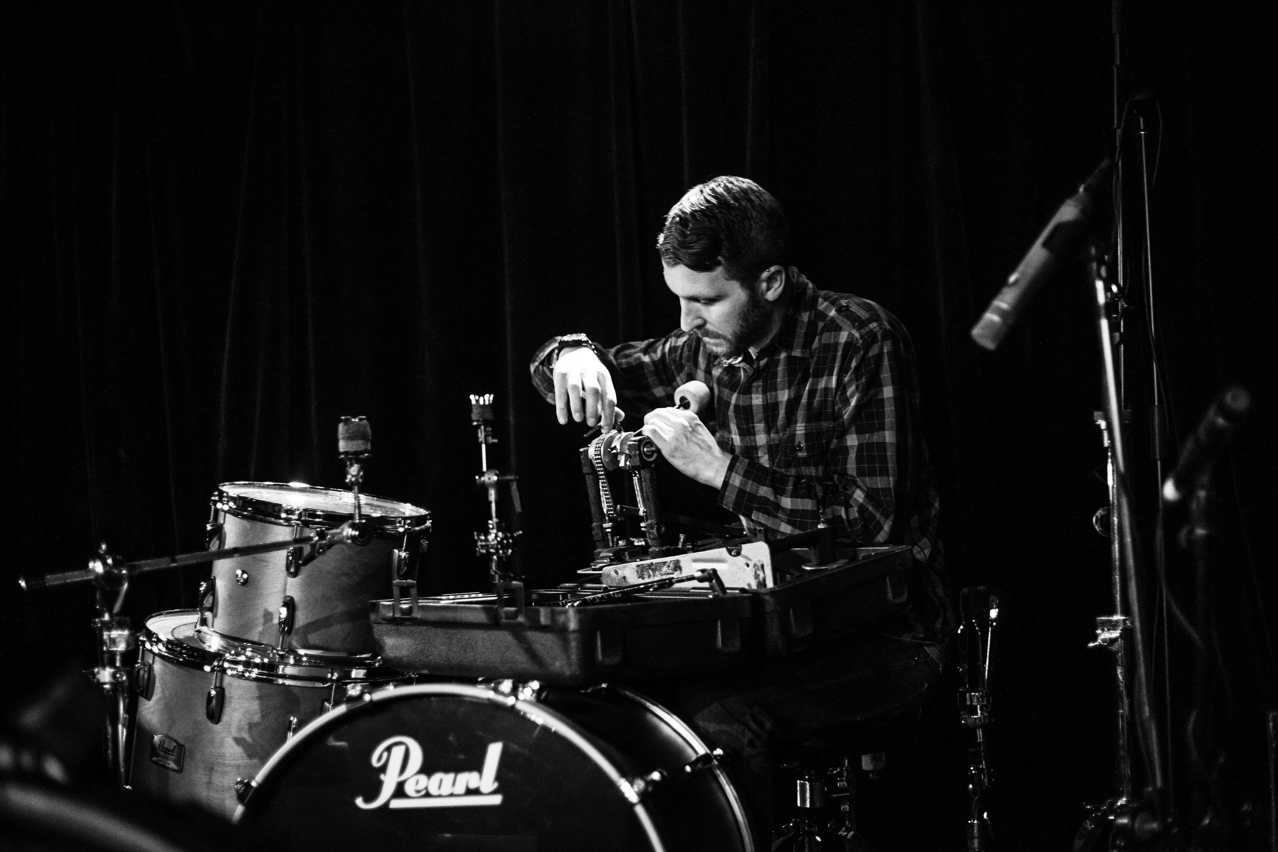 Steve Gibson adjusts the bass drum beater on his bass pedal as Signals Midwest sets up for their first show of their run on the tour at Le Divan Orange in Montreal, Quebec, Tuesday April 5, 2016.