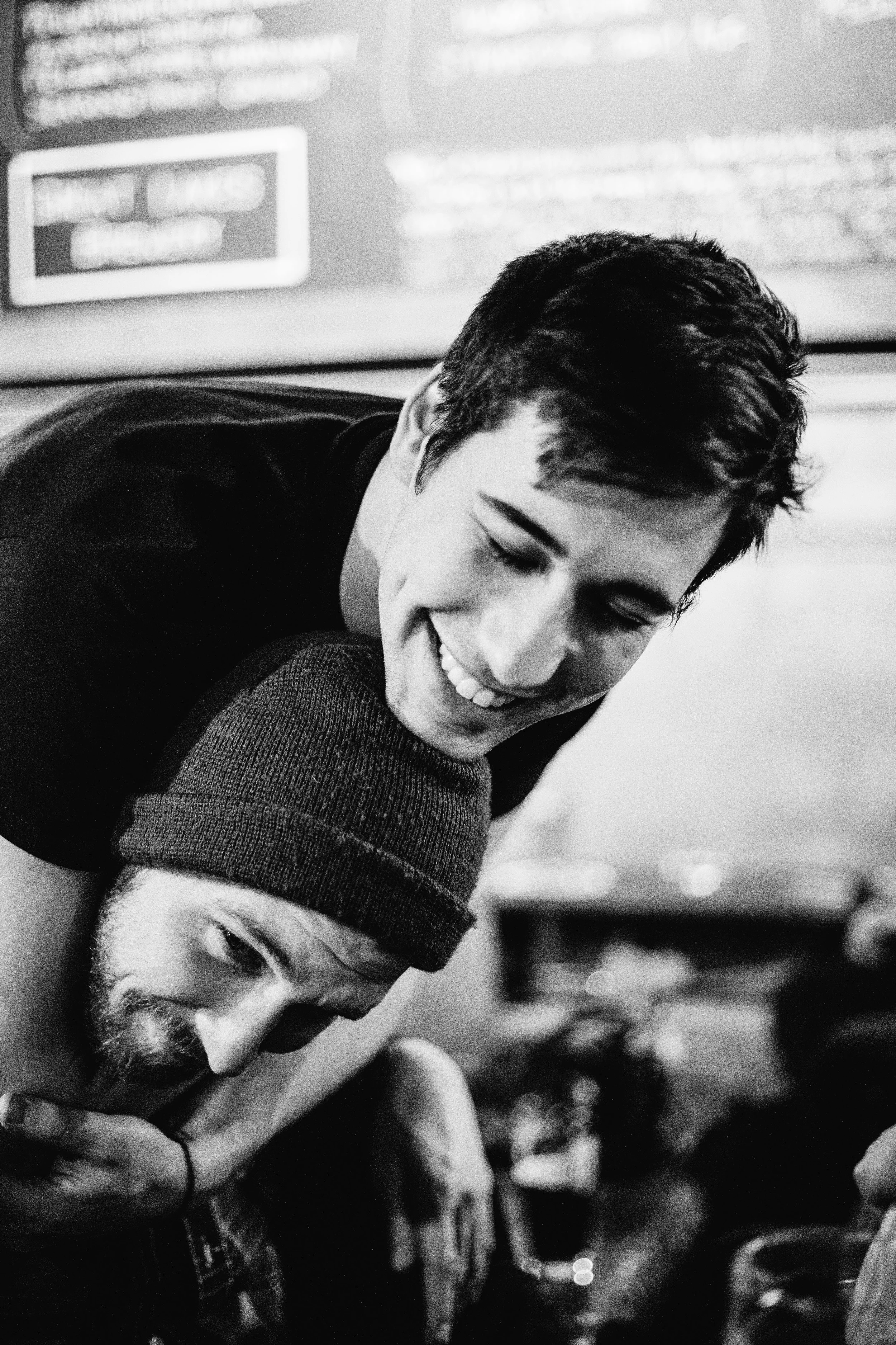 Max Stern hugs Steve Gibson from behind at Bryden's in Toronto, Ontario, Wednesday April 6, 2016. 
