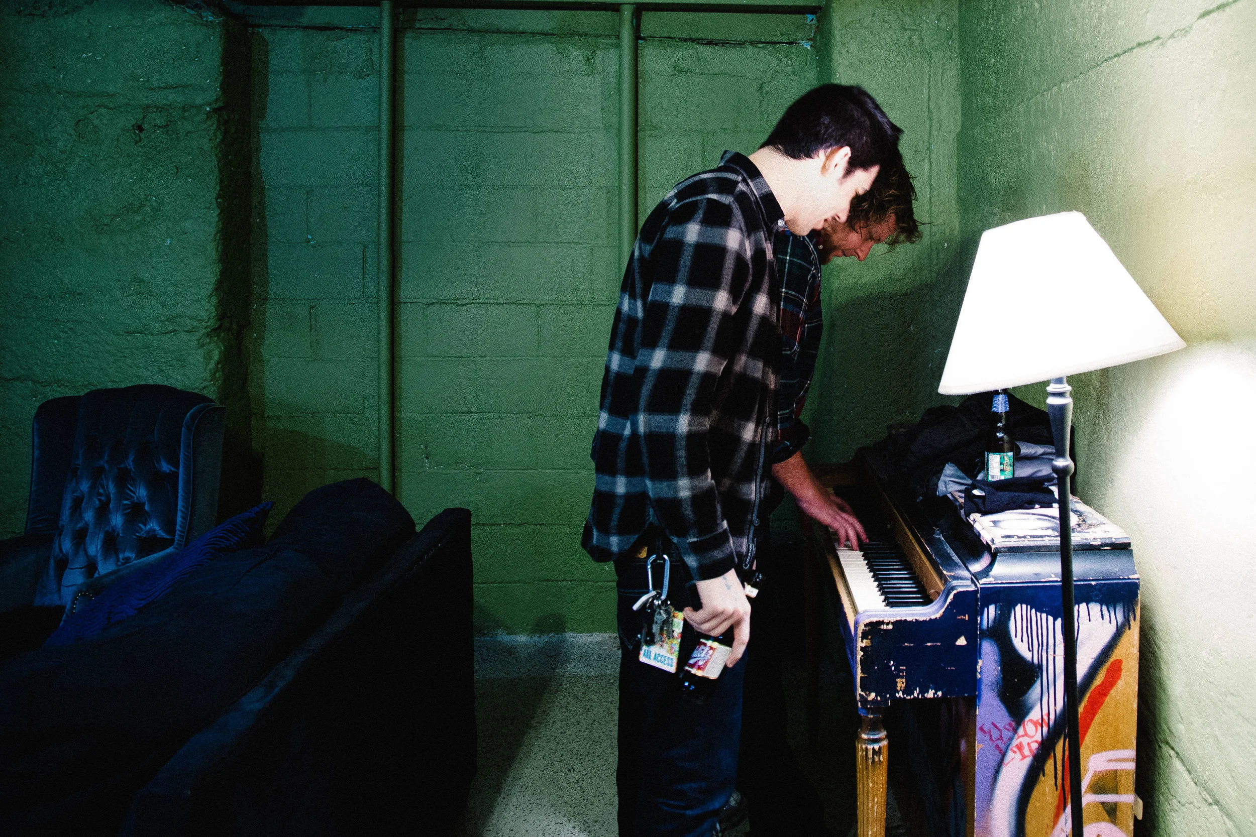 Max Stern watches as Wil Wagner plays on a very out of tune piano at The Crofoot in Pontiac, Michigan, Saturday, April 9 2016.